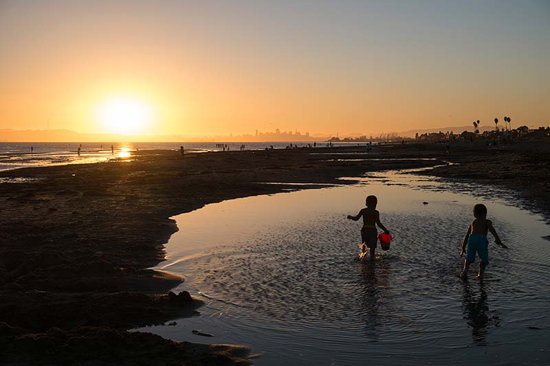 Two Kids Playing in Water at Robert Crown Memorial State Beach, Alameda, California